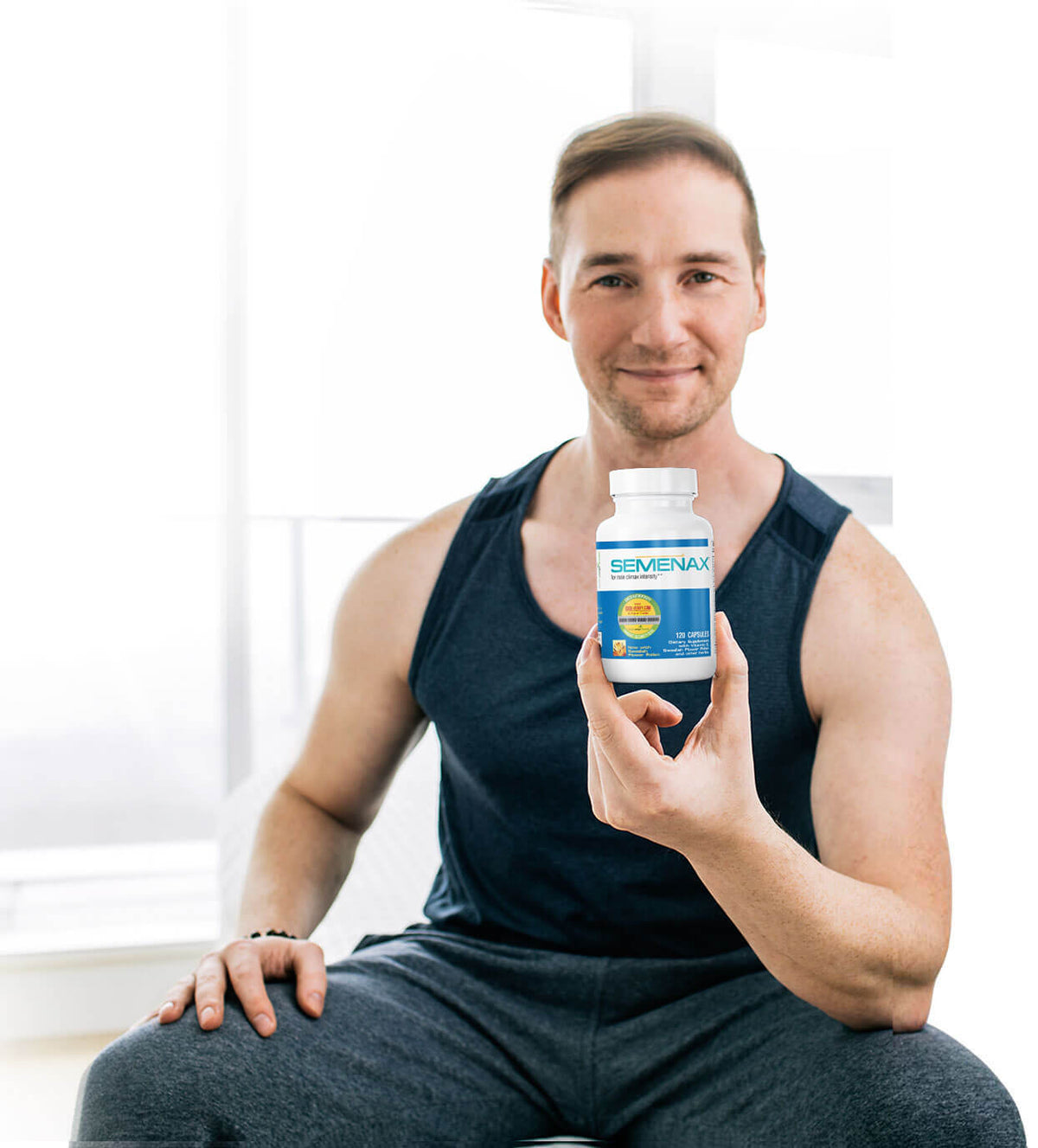 Man holding a bottle of Semenax